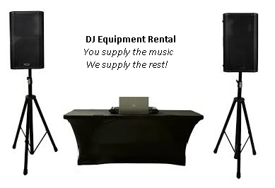 DJ equipment setup with speakers and table.